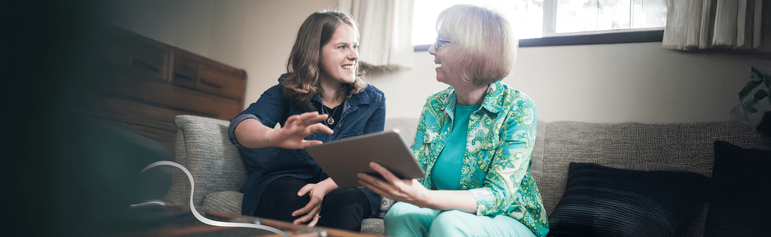 Senior care advisor helping an elderly woman